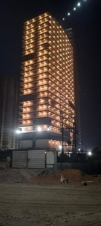 F Premiere Tower C, finished with balconies lit at night, Kharghar, Navi Mumbai
